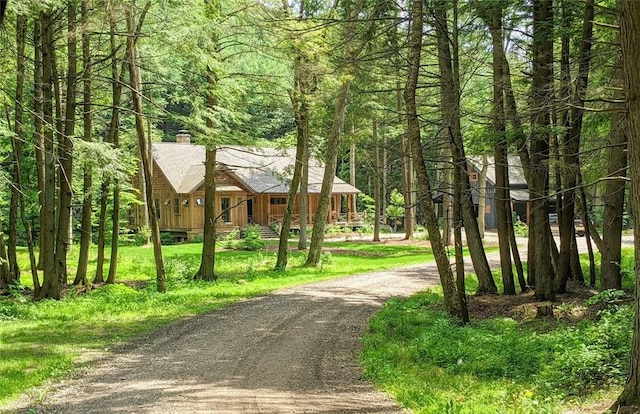 surrounding community featuring a lawn and driveway