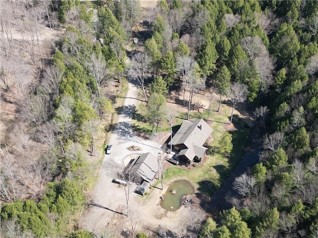 drone / aerial view featuring a forest view