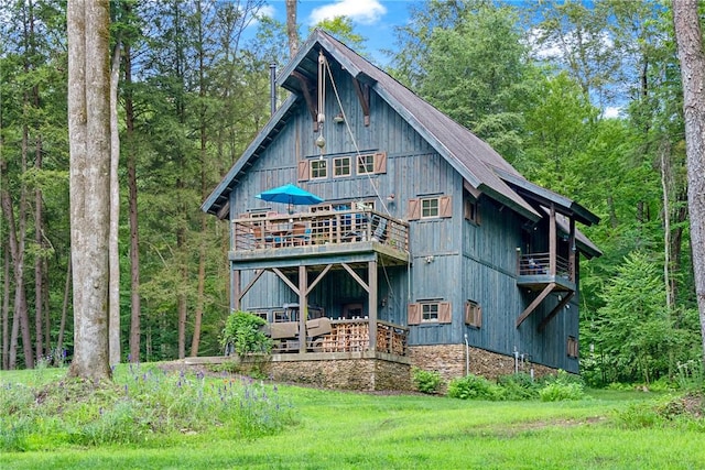 000 Wonder Ln, Punxsutawney Area School District, PA 15767 - back of house featuring a view of trees, a balcony, and a deck