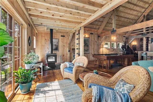 000 Wonder Ln, Punxsutawney Area School District, PA 15767 - living area with plenty of natural light, wooden walls, a wood stove, billiards, and wood finished floors