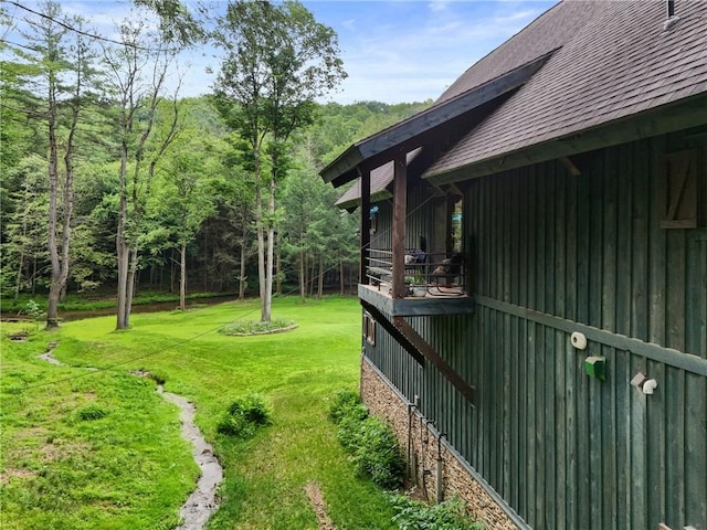 000 Wonder Ln, Punxsutawney Area School District, PA 15767 - view of green lawn featuring a balcony and a wooded view