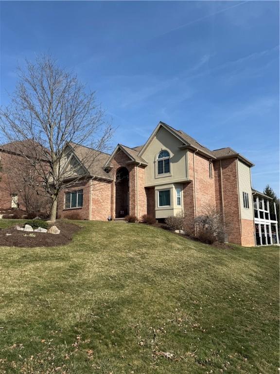 2004 Arlington, Murrysville, PA 15632 - view of front of home featuring brick siding and a front yard