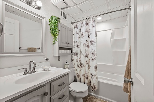 full bath with vanity, shower / bath combination with curtain, toilet, and visible vents