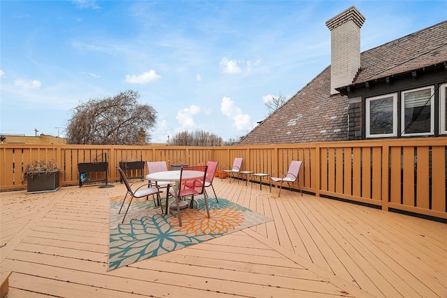 deck featuring outdoor dining area