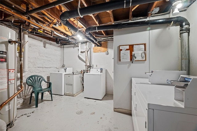 unfinished basement featuring washer and dryer and gas water heater