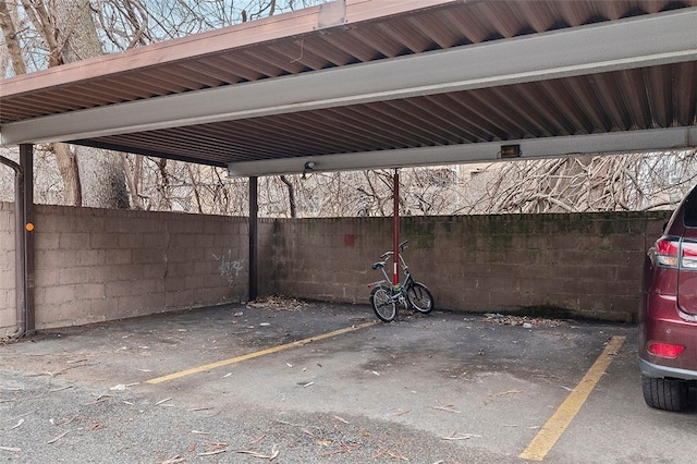 covered parking lot with fence