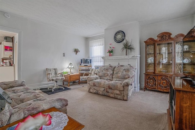 living room with a textured ceiling and carpet