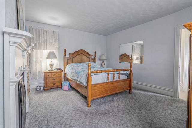 bedroom featuring baseboards and carpet floors