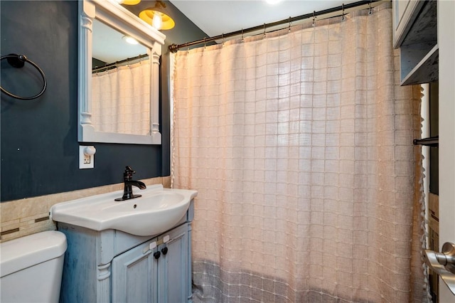 bathroom with toilet and vanity