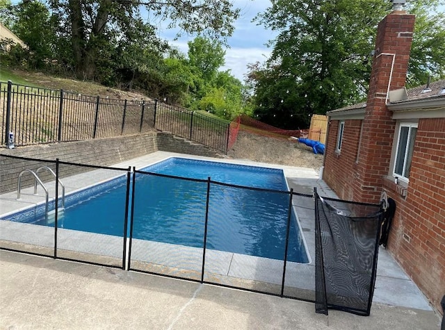 view of swimming pool featuring a fenced in pool and a fenced backyard