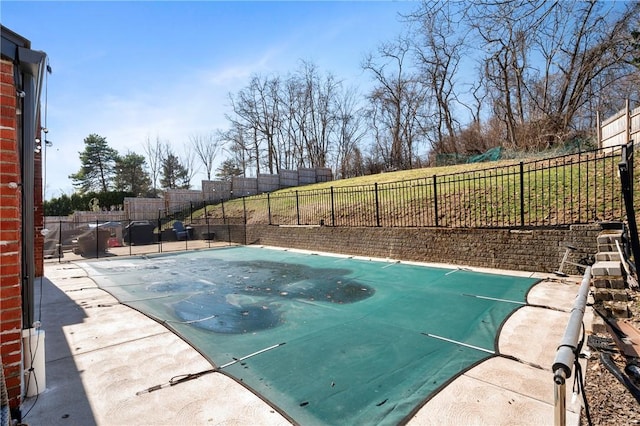 view of swimming pool with a fenced backyard