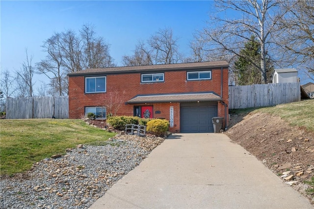 view of front facade with a front lawn, fence, concrete driveway, a garage, and brick siding