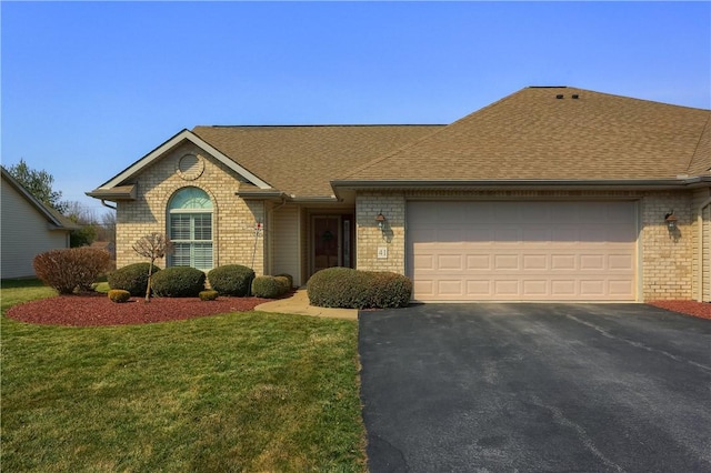 single story home with a front yard, roof with shingles, a garage, aphalt driveway, and brick siding