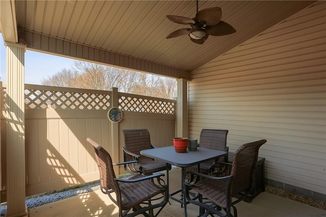 view of patio / terrace featuring outdoor dining space, ceiling fan, and fence