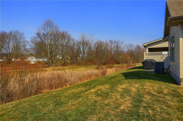 view of yard featuring central air condition unit