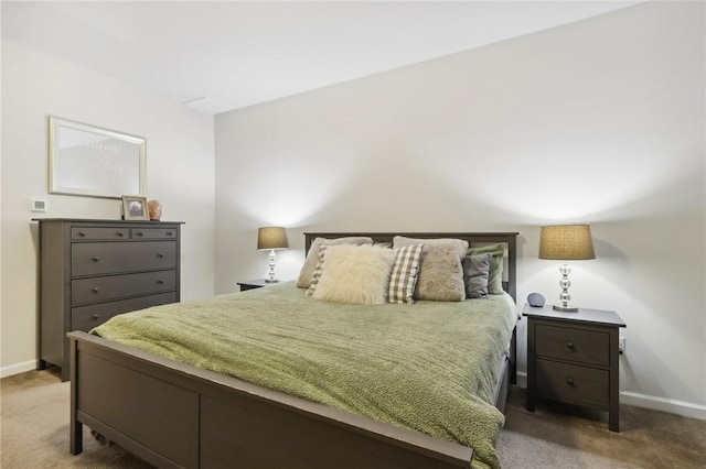 bedroom featuring baseboards and light colored carpet