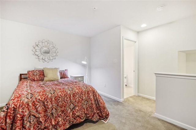 carpeted bedroom featuring recessed lighting and baseboards