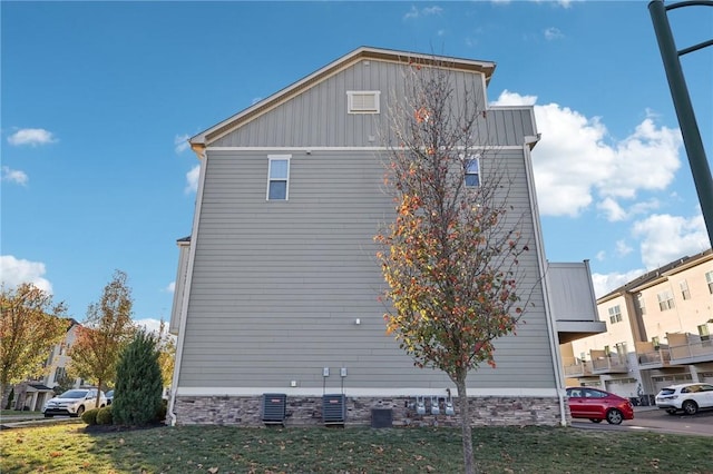 view of home's exterior with central AC unit