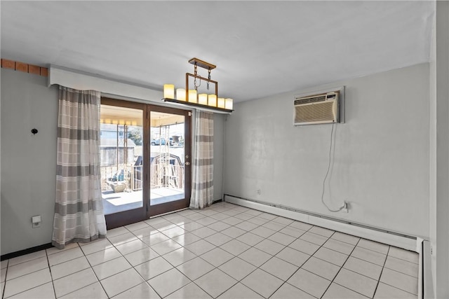 spare room with a wall mounted AC, light tile patterned flooring, baseboards, and a baseboard radiator