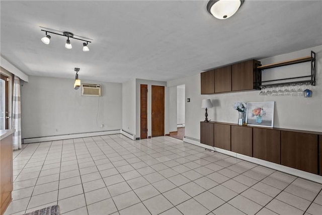 interior space with light tile patterned flooring, open shelves, an AC wall unit, and a baseboard radiator