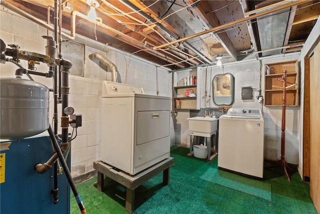 unfinished below grade area with independent washer and dryer, a heating unit, and a sink