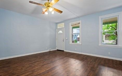 foyer featuring dark wood-style floors, baseboards, and ceiling fan