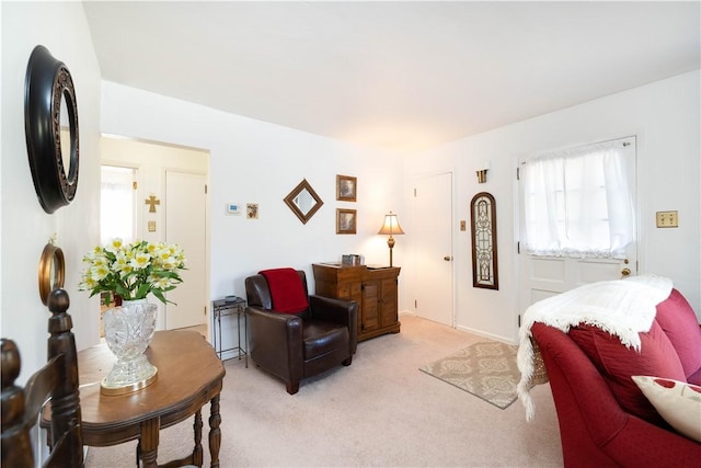 living room featuring light carpet