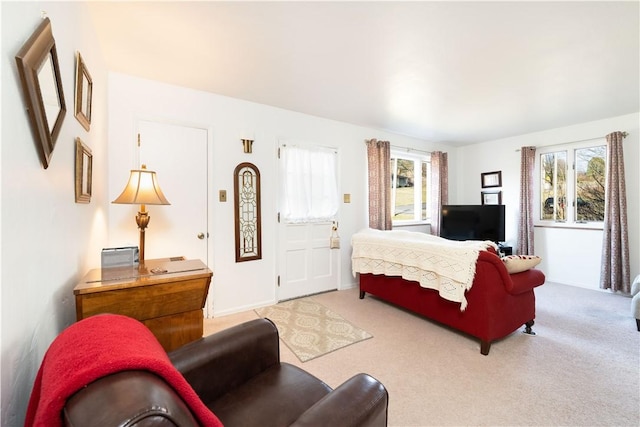 bedroom featuring light colored carpet