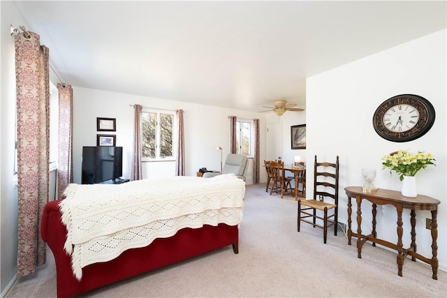 carpeted bedroom featuring a ceiling fan