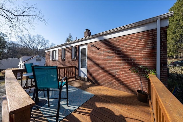 wooden deck featuring outdoor dining space