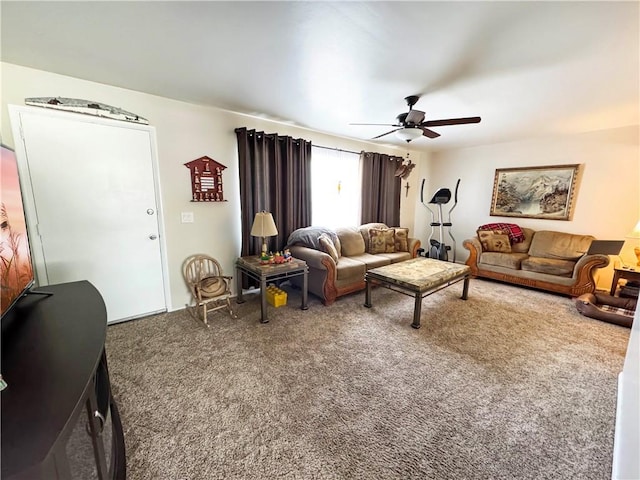 carpeted living area featuring a ceiling fan