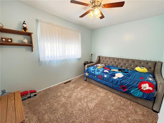 bedroom featuring visible vents, carpet flooring, a ceiling fan, and baseboards