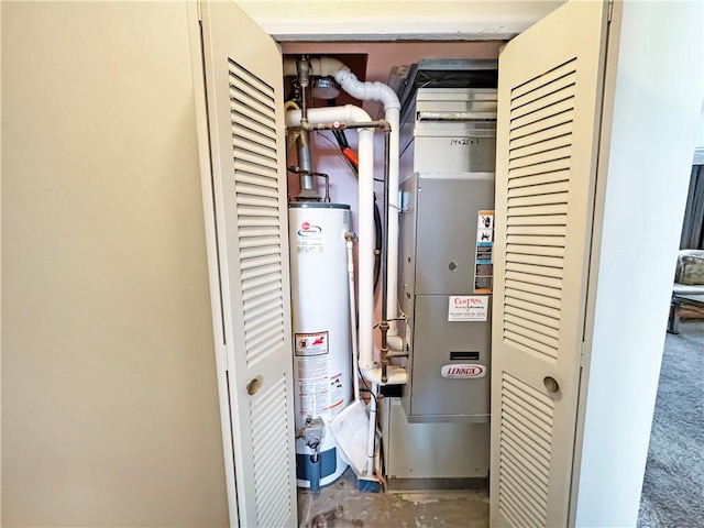 utility room featuring water heater