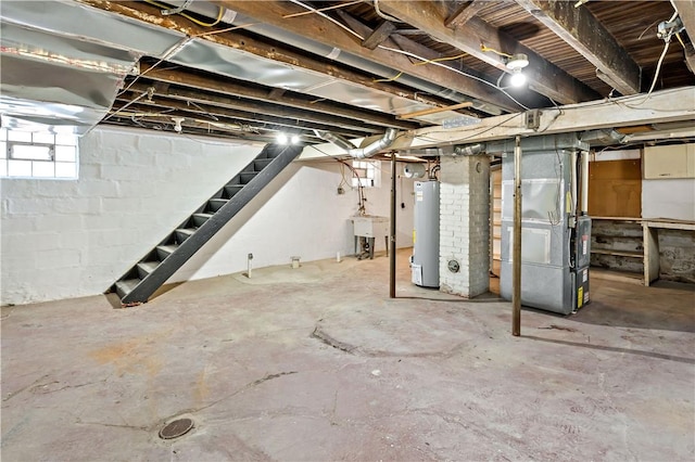 below grade area with gas water heater, stairway, heating unit, and a sink