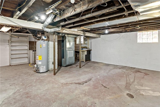 basement with gas water heater and heating unit