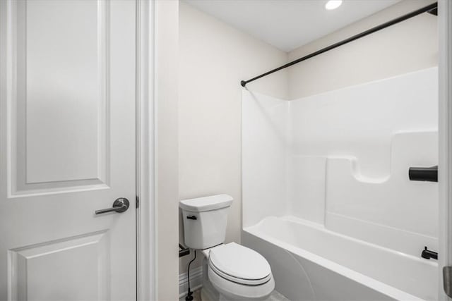 bathroom with toilet and bathtub / shower combination