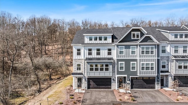 130 Rainier Ln, Marshall, PA 15090 - view of front of home with stone siding, board and batten siding, and a garage