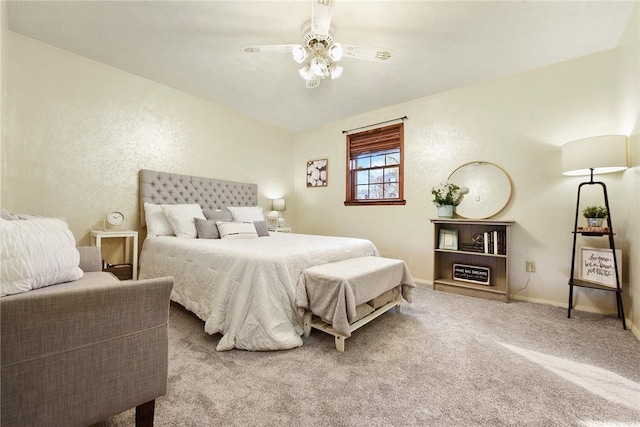 carpeted bedroom with baseboards and ceiling fan