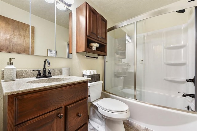 bathroom featuring bath / shower combo with glass door, toilet, vanity, and a textured ceiling