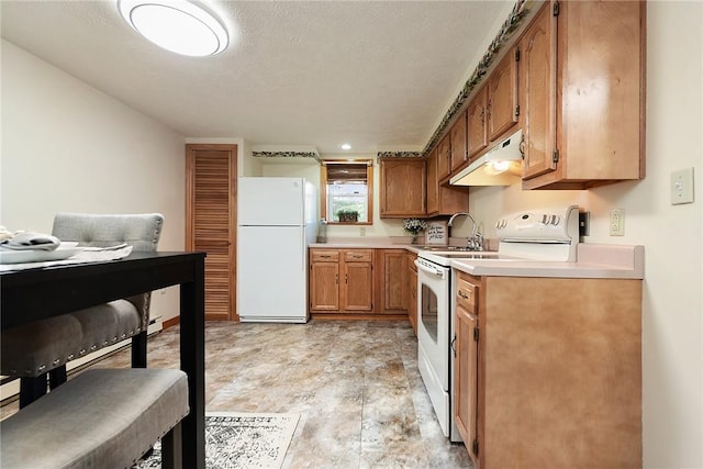 kitchen featuring white appliances, a sink, light countertops, under cabinet range hood, and a textured ceiling