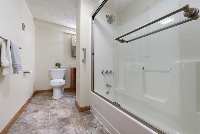 bathroom with vanity, baseboards, enclosed tub / shower combo, a textured ceiling, and toilet