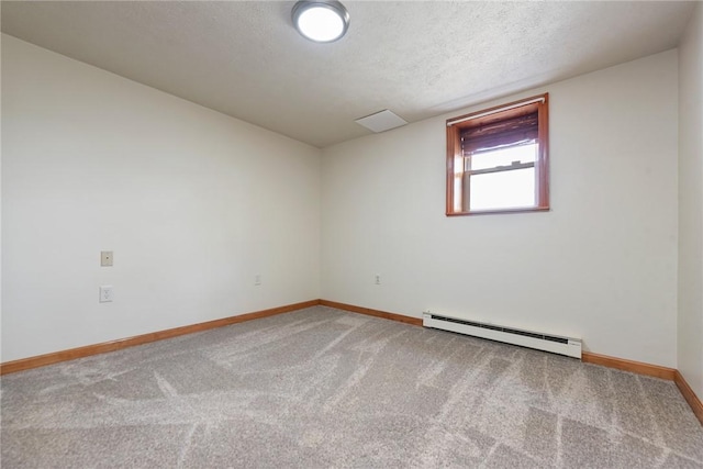 unfurnished room with carpet flooring, a textured ceiling, baseboards, and a baseboard radiator