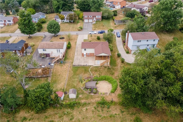 birds eye view of property with a residential view