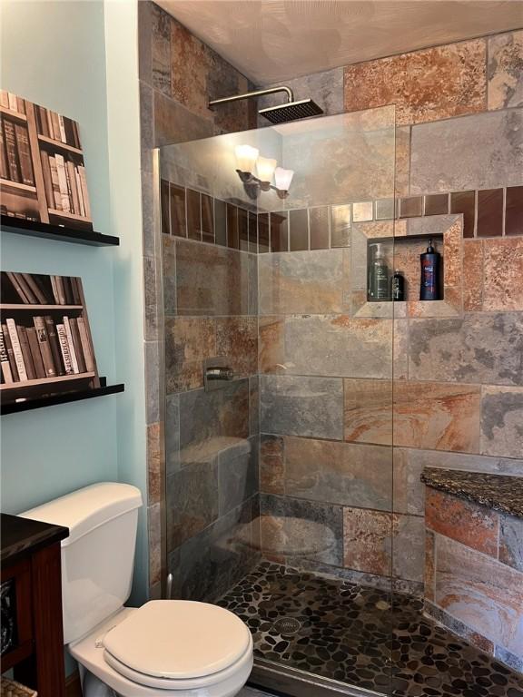 full bathroom with toilet and walk in shower