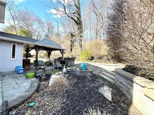 view of yard with a gazebo and a patio