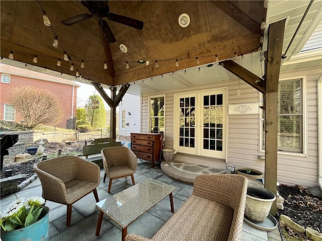 view of patio with a gazebo, french doors, fence, and ceiling fan