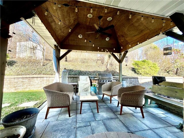 view of patio / terrace with a gazebo, an outdoor hangout area, a grill, and a ceiling fan