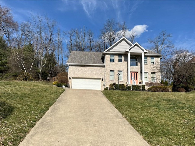 neoclassical home with driveway and a front lawn