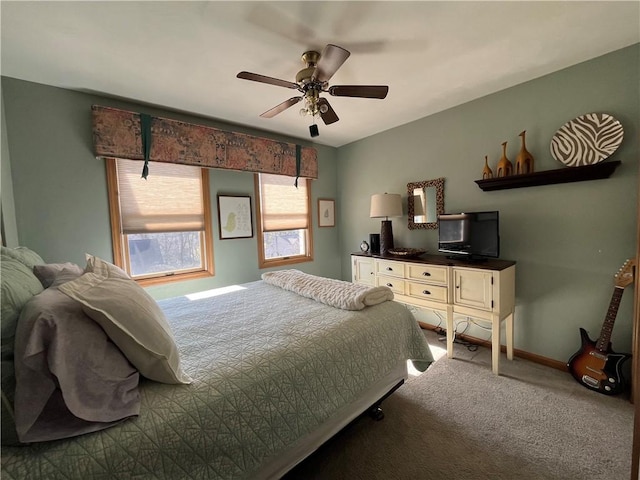 bedroom with baseboards, carpet floors, and a ceiling fan