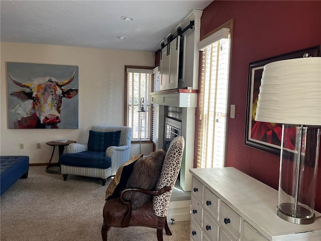 living room with light colored carpet and a tile fireplace